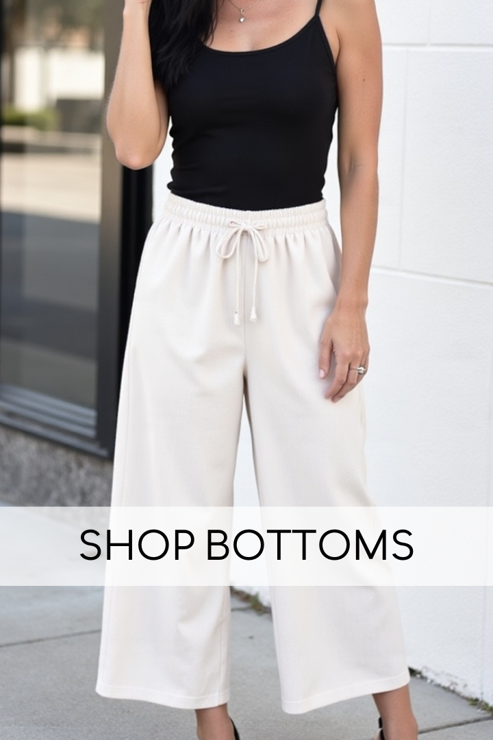 Model wearing a black tank top and cream wide leg pants with "Shop Bottoms" text